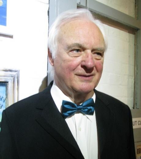 A person in a suit and bow tie</p>
<p>AI-generated content may be incorrect.