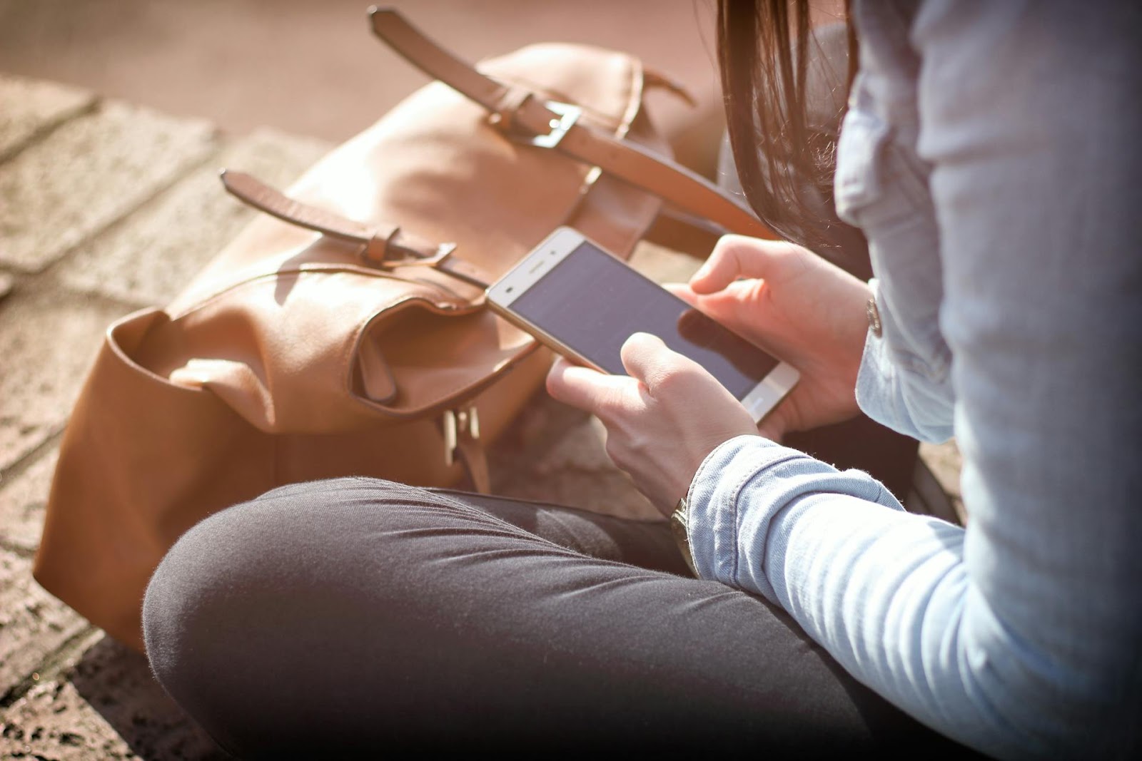 A woman looking at her phone | Source: Pexels