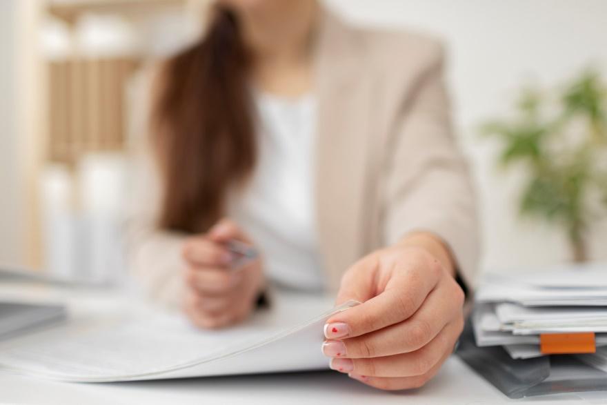 A woman arranging the tax documents. 