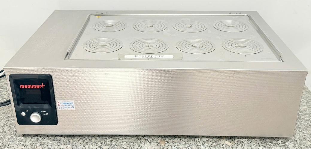 A silver rectangular object with circular burners

AI-generated content may be incorrect.