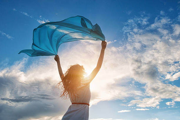 Woman with vibrant energy, representing the benefits of energy vitamins for women.
