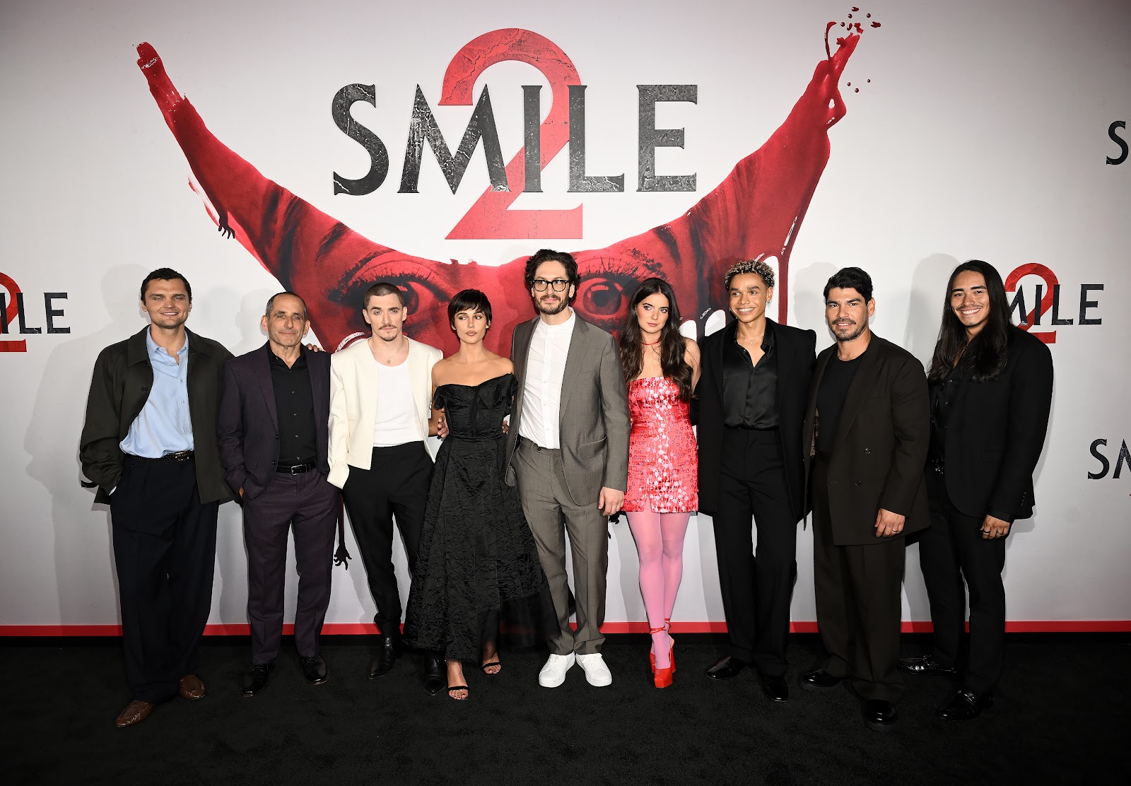 Ray Nicholson, Peter Jacobson, Kyle Gallner, Naomi Scott, Parker Finn, Dylan Gelula, Miles Gutierrez, Raul Castillo, and Iván Carlo at the "Smile 2" premiere in Los Angeles, California, on October 14, 2024 | Source: Getty Images