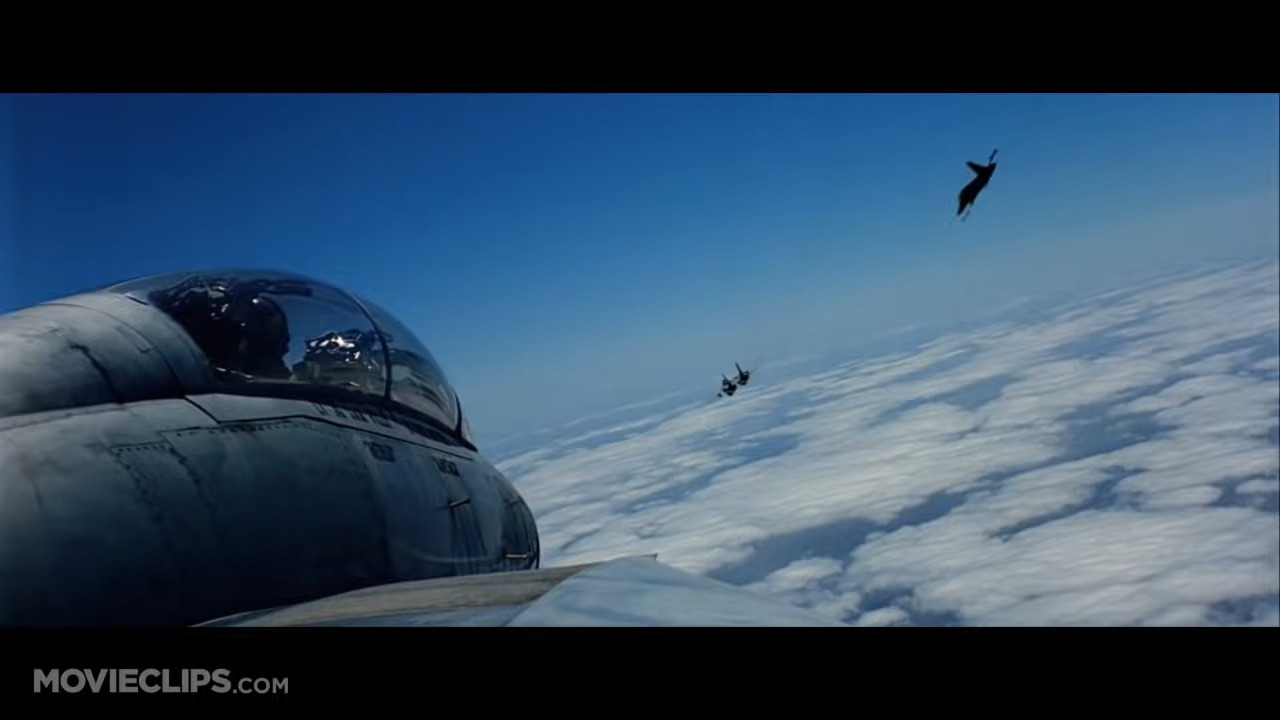 Fighter plane cockpit looking behind 2 other planes.