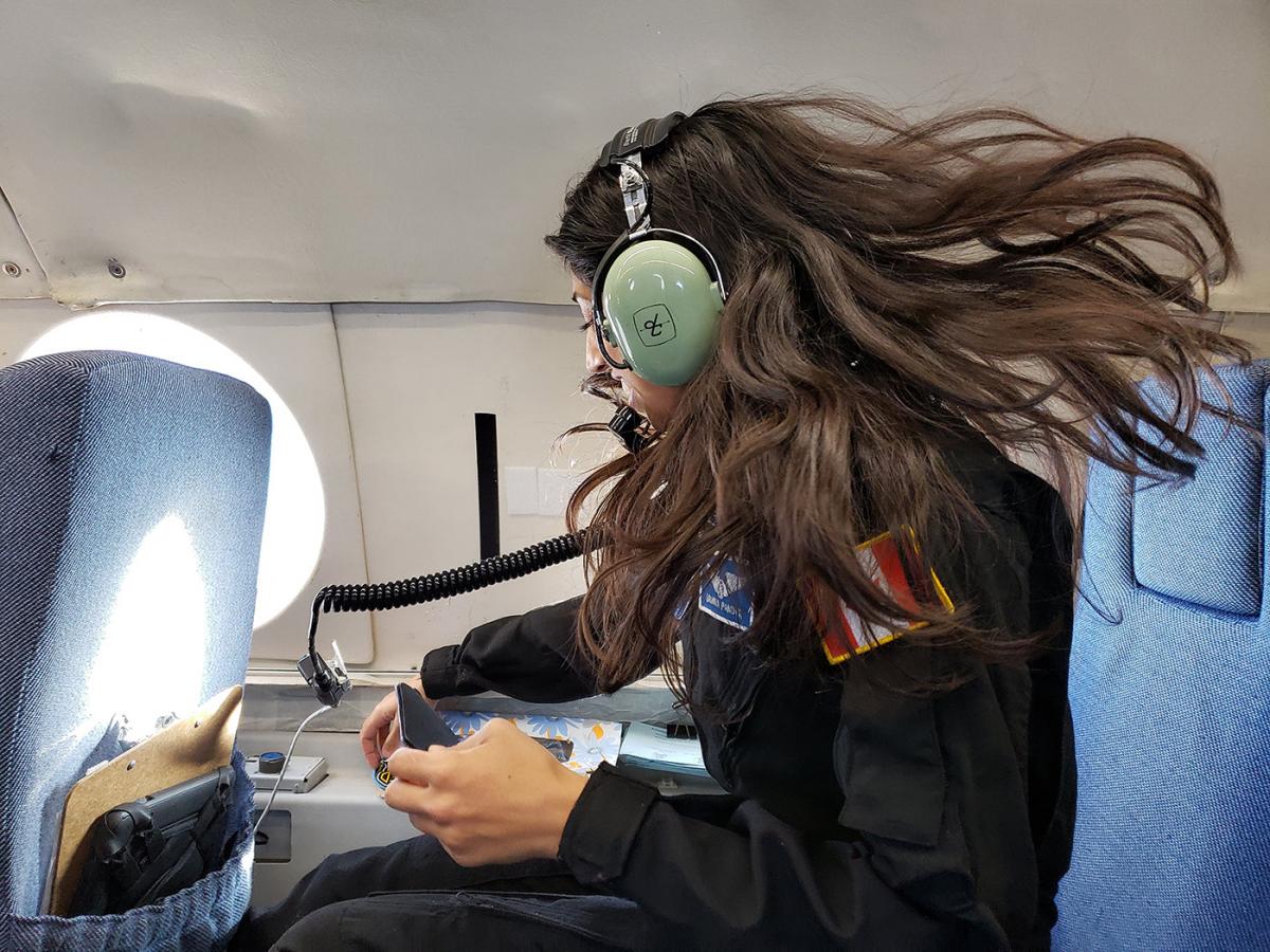 Dr. Shawna Pandya in blue IVA suit tests a next-generation Final Frontier IVA (intravehicular activity) spacesuit in microgravity during the 2018 PoSSUM parabolic flight campaign