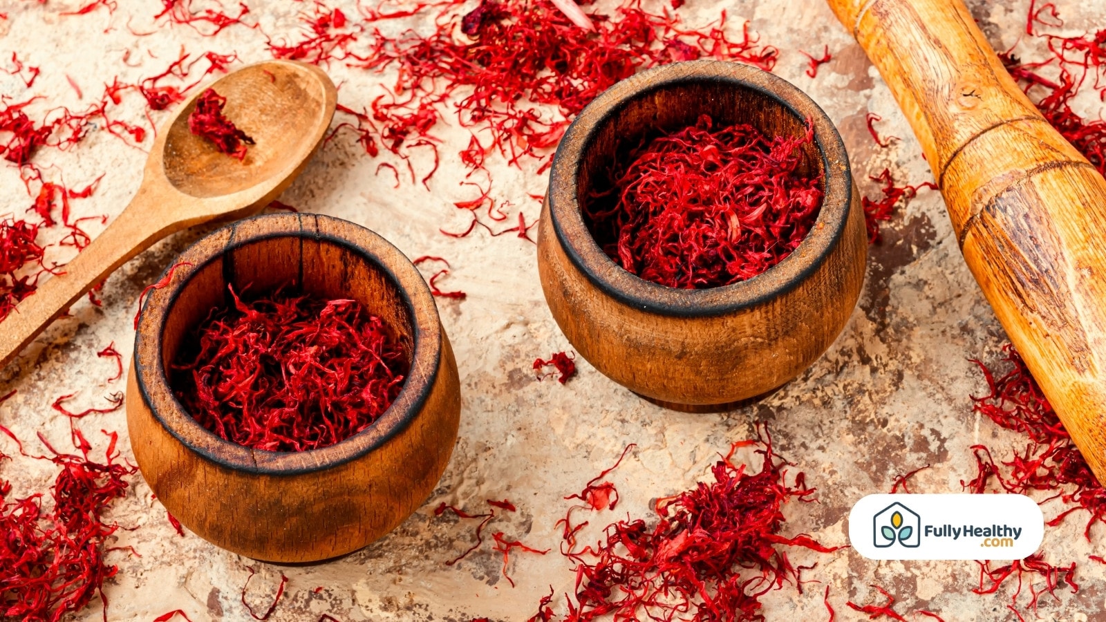 Two wooden bowls filled with dried saffron threads