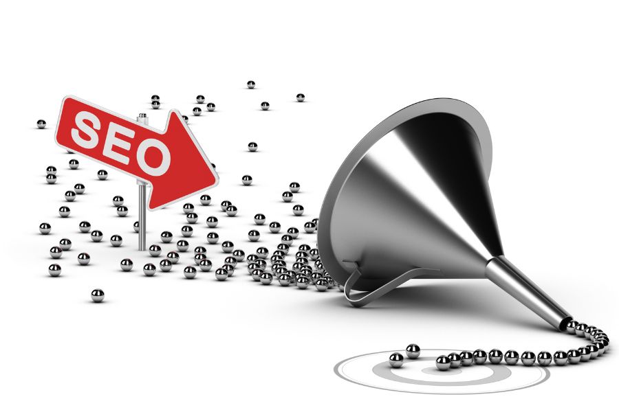 SEO concept with funnel and balls directed by an arrow.