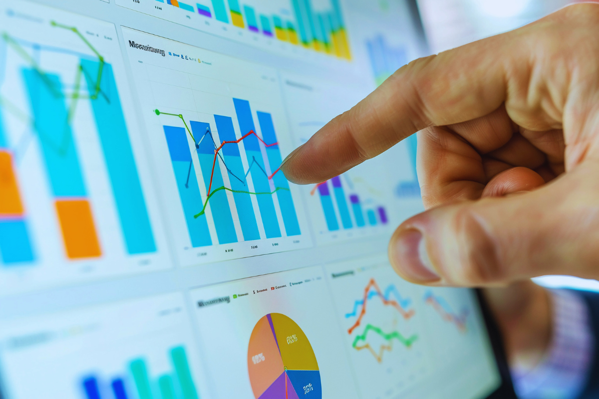 pointing to a chart on a data analytics dashboard