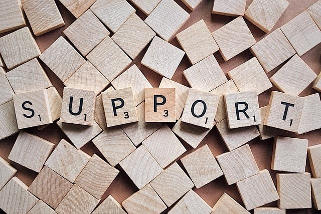 Support spelled out by Scrabble letters shows concept of getting recovery help using AHCCCS