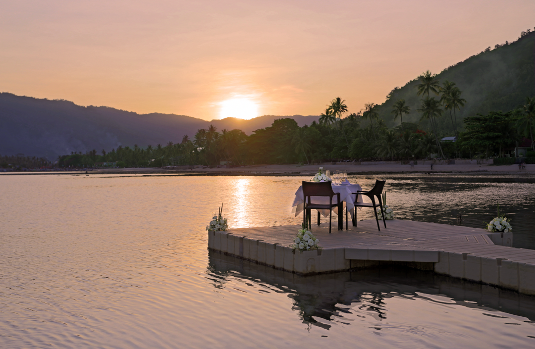A table and chairs on a dock in the water

AI-generated content may be incorrect., Picture