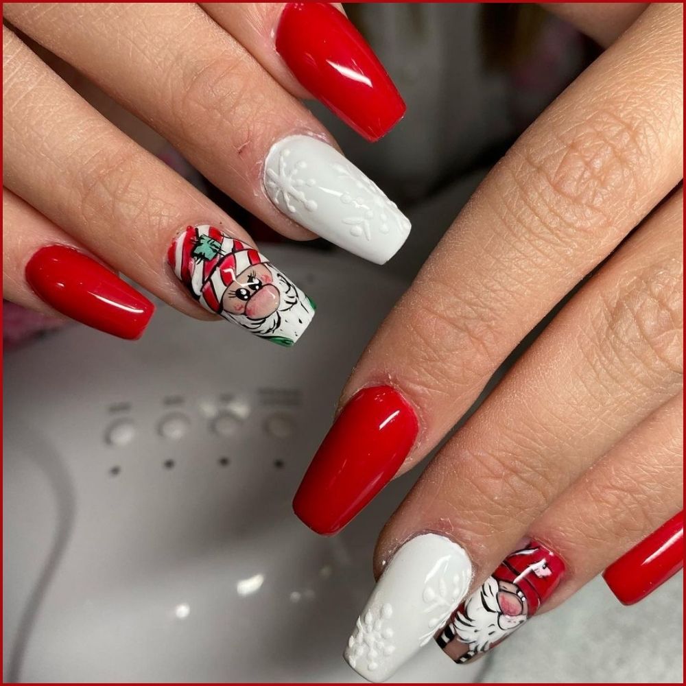 Close up of hands having Christmas red nails with Santa’s Red and White Delight