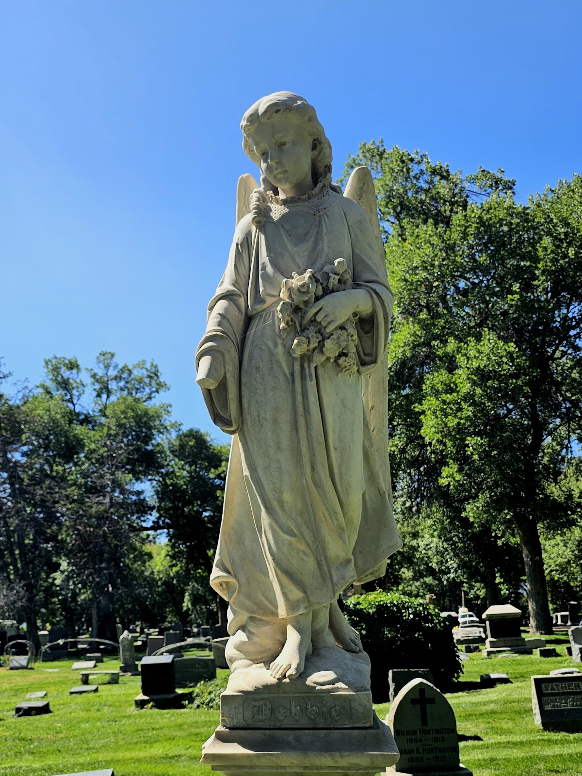 A headstone monument in the shape of an angel