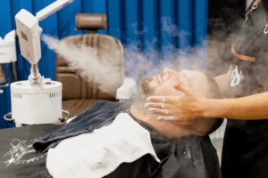 barber-giving-customer-steam-treatment-before-shaving