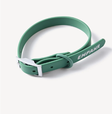 A close-up of an adjustable, waterproof dog collar in a vibrant green color.