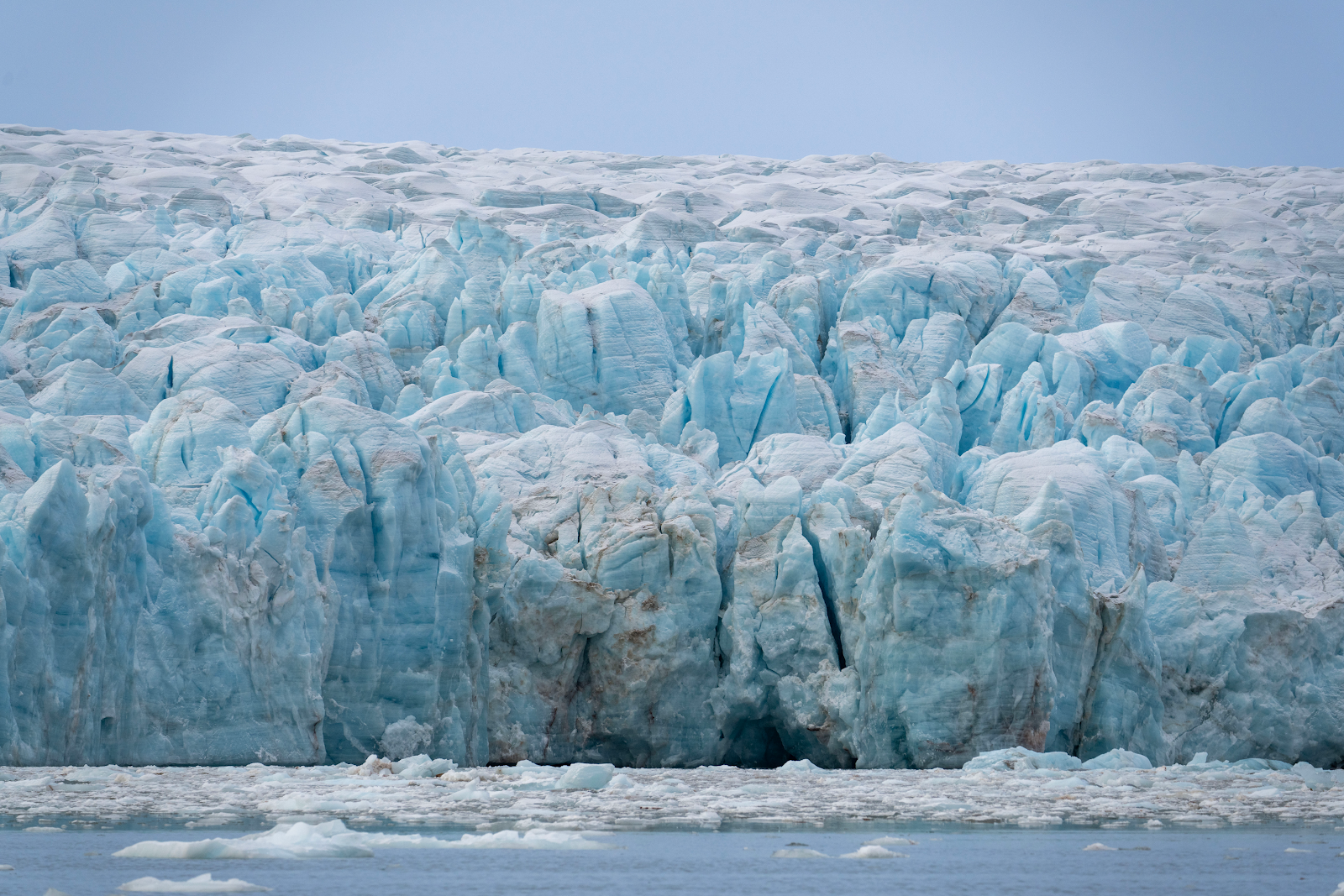 A glacier with ice and water with Perito Moreno Glacier in the background

AI-generated content may be incorrect.