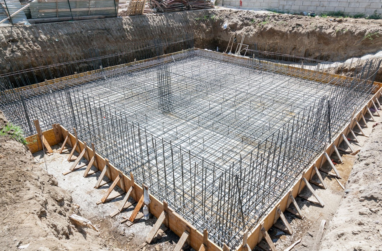 Steel-reinforced concrete foundation for a residential house