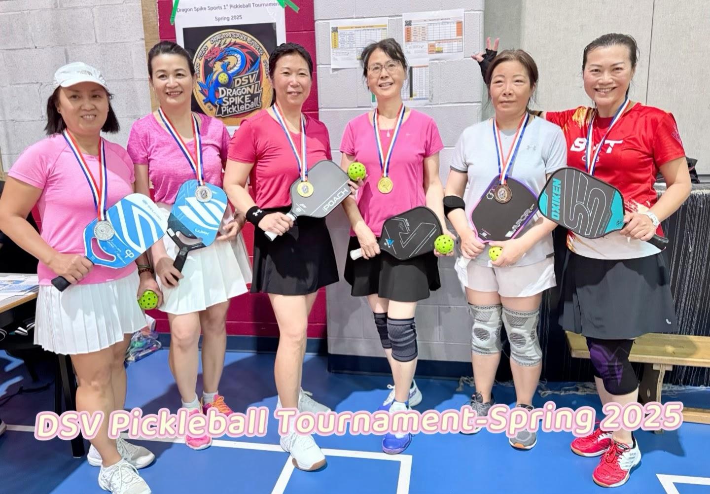 A group of women holding paddles and balls

AI-generated content may be incorrect.