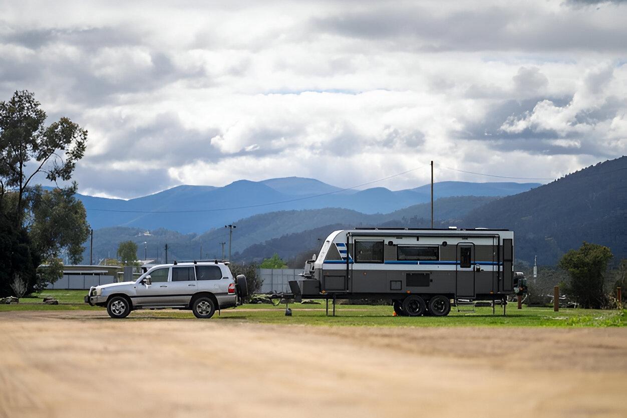 A trailer on a trailer in a parking lot Description automatically generated