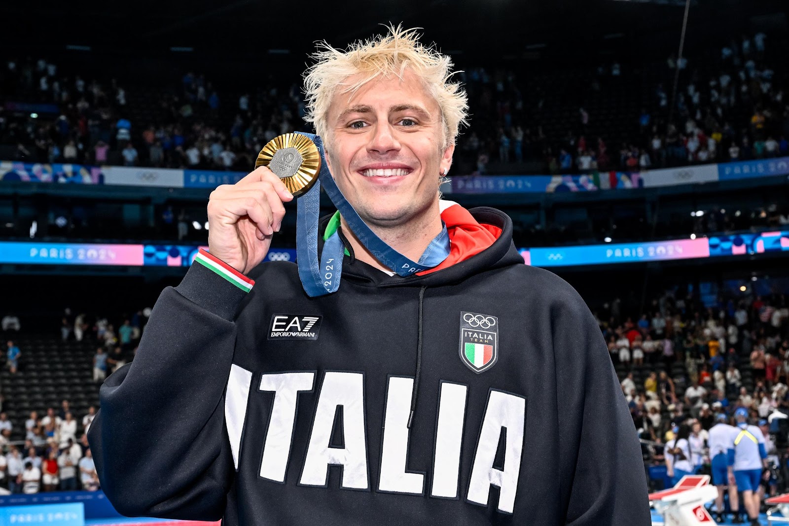 Nicolo Martinenghi of Italy holds his gold medal after the Men's 100m Breaststroke Final at the Paris 2024 Olympic Games on July 28, 2024 | Source: Getty Images