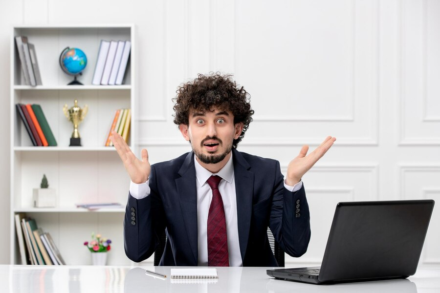 A man with a confused look in an office