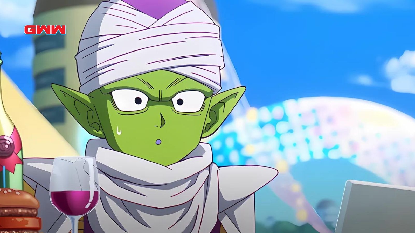 Piccolo looking confused holding a drink in Dragon Ball Daima celebration