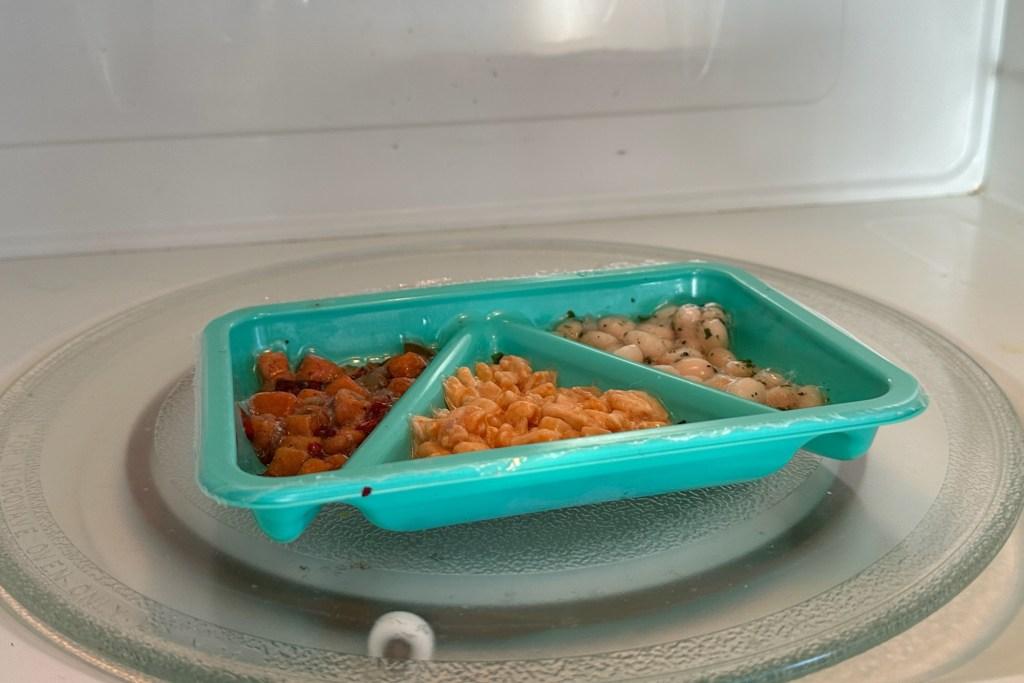 A blue tray filled with food