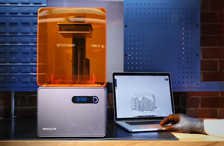 3D printer printing a small object.