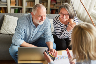 how tariffs will affect your home remodeling project elderly couple talking to financial advisor about remodel budget custom built michigan