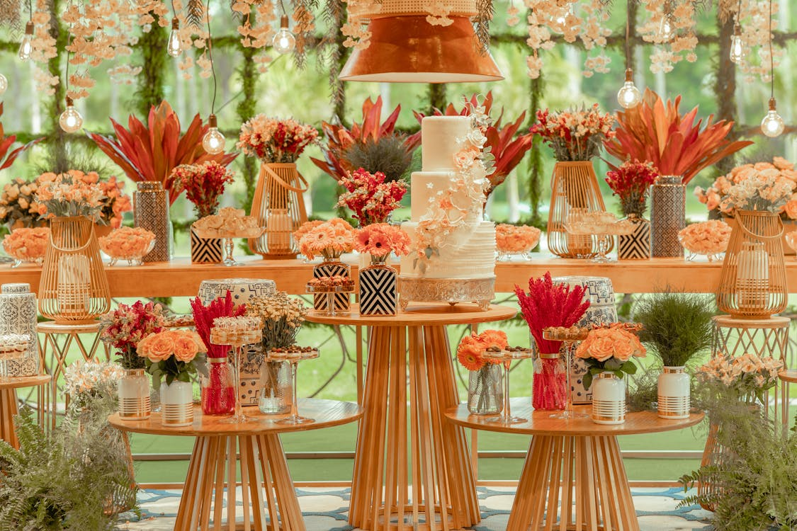 Photo by Juliano Astc: https://www.pexels.com/photo/flowers-around-decorated-tables-with-cake-12303267/ 