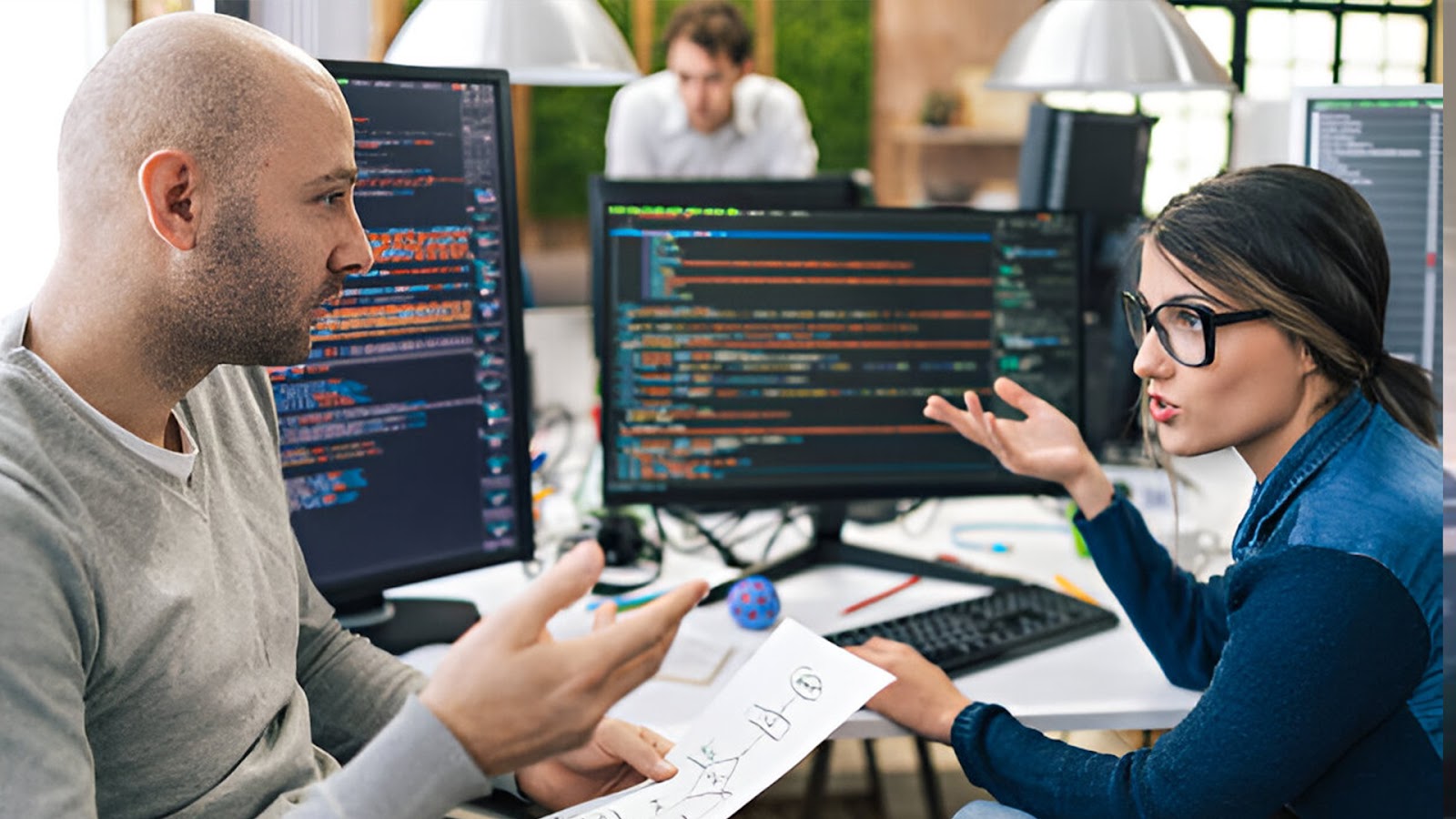 two persons discussing about the web development life cycle 