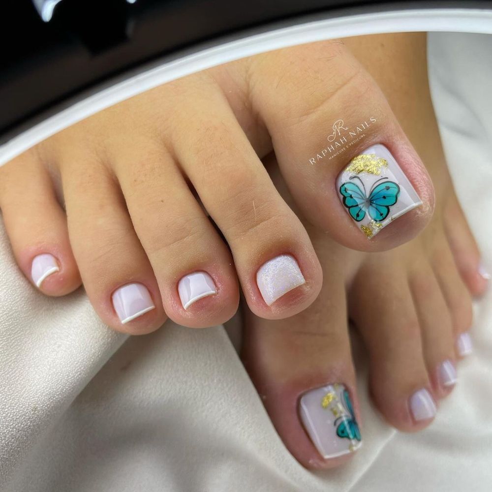 Close up of foot with radiant toe nail having Butterfly Toe Nail Designs