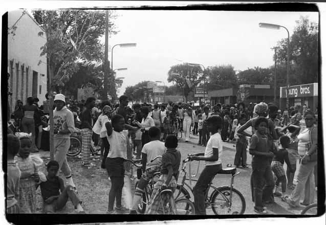 Image: A black-and-white photo of Northside residents gathering for a Way event. Sourced from Minnesota Historical Society.