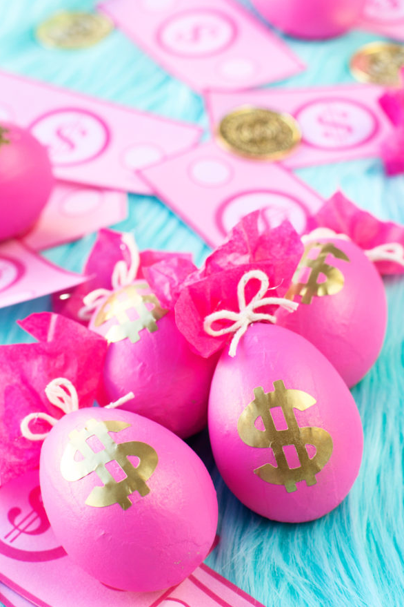 easter egg hunt ideas, pink eggs with gold dollar sign stickers on the front