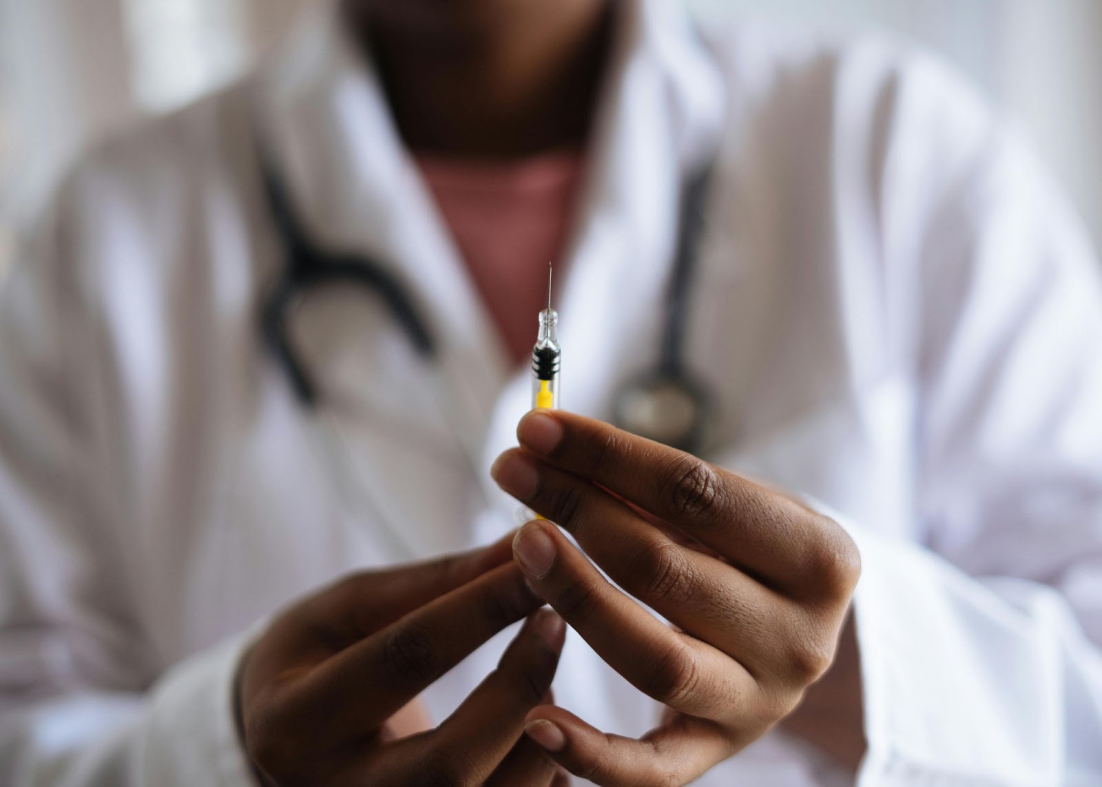 Doctor holding a syringe with morphine