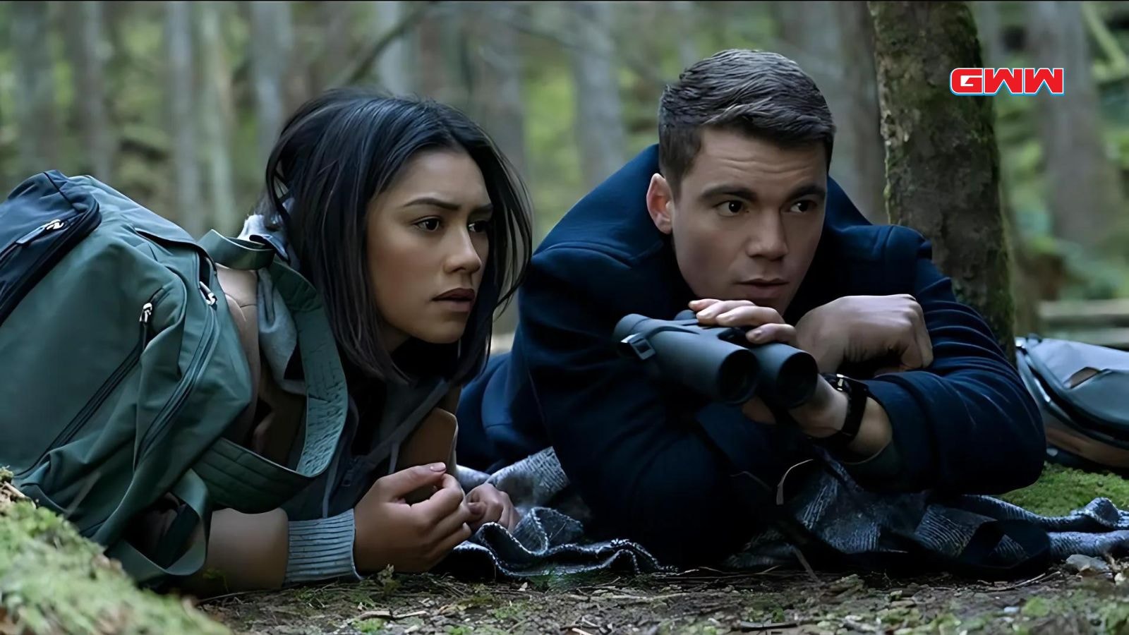 Gabriel Basso and Luciane Buchanan in the woods in The Night Agent Season 1