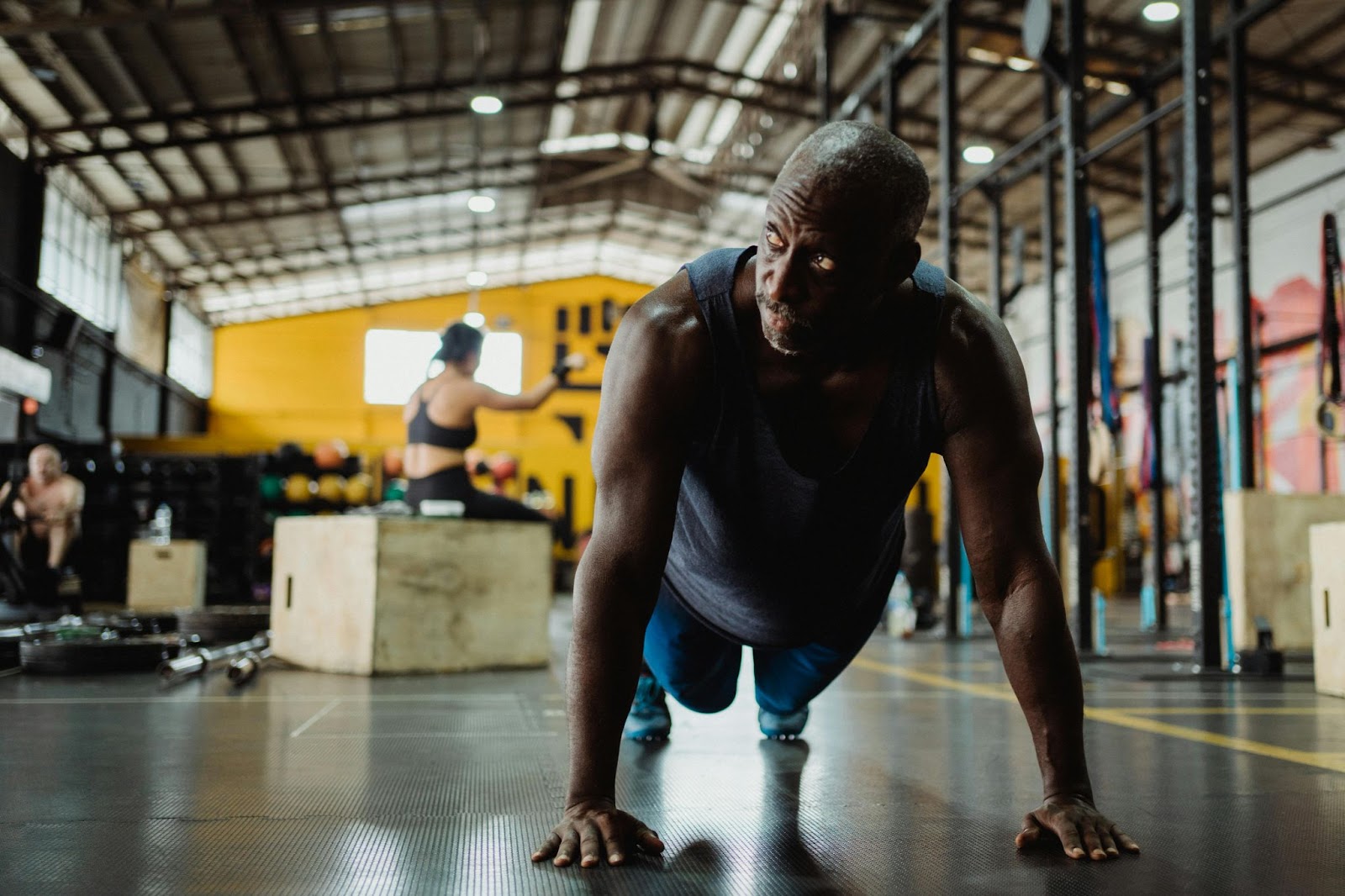 An older man doing pushups