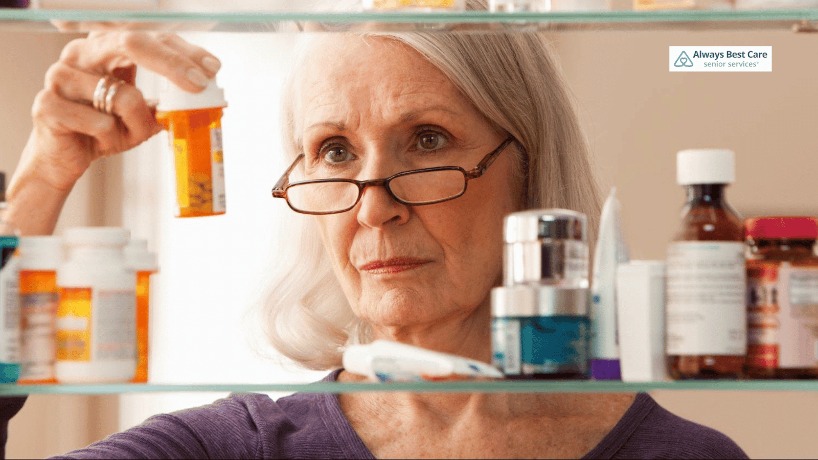 This image depicts a senior checking a vial of medicine