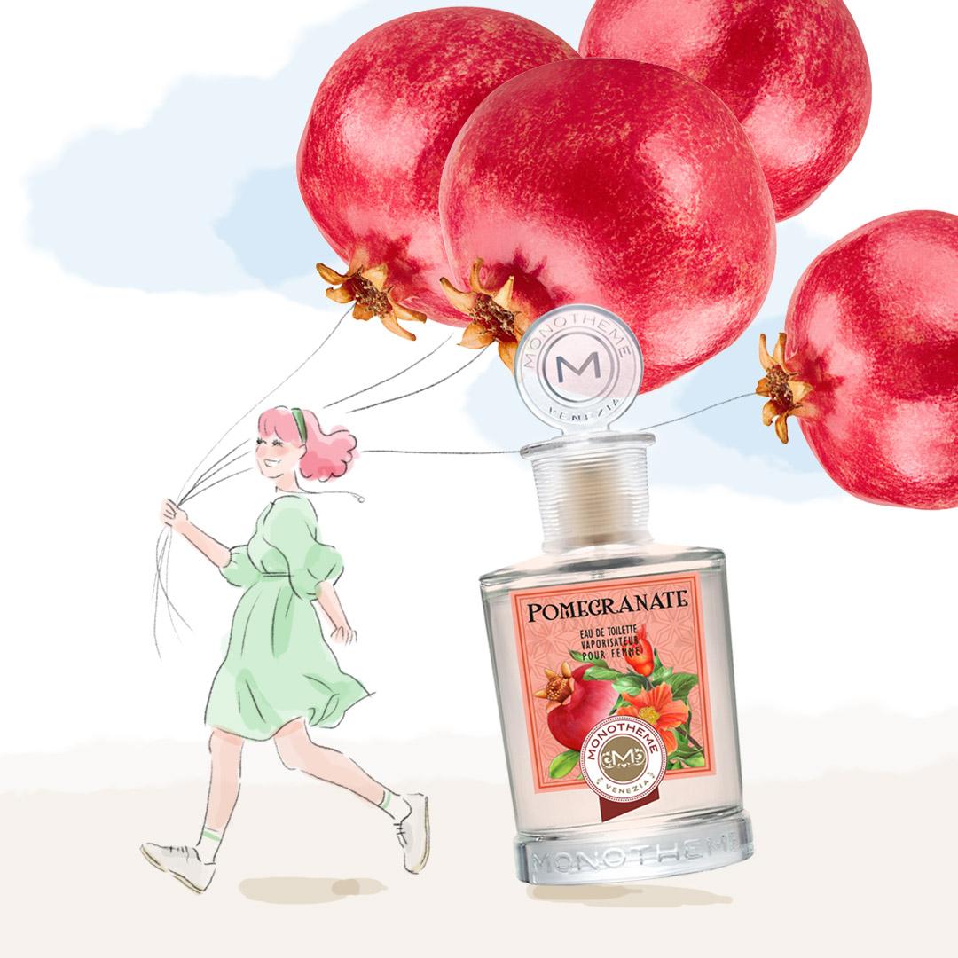 A bottle of perfume with pomegranates

Description automatically generated