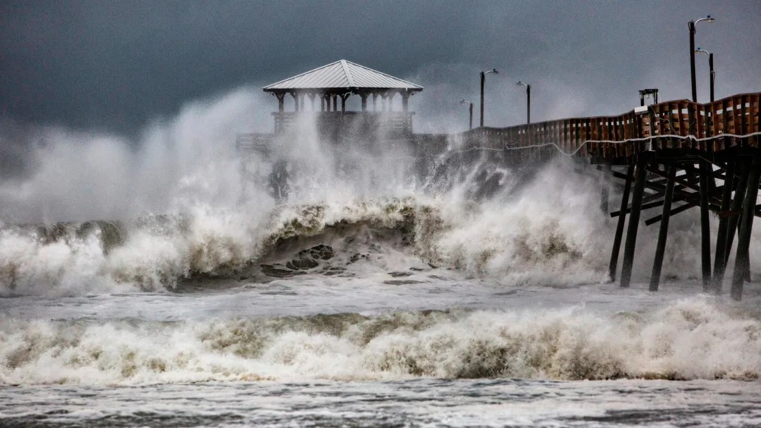 Waves crash around Oceanana Pier in Atlantic Beach.