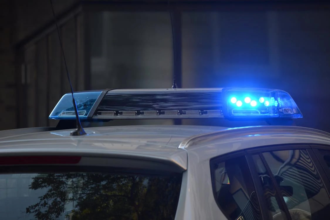 Siren Lighting up on Top of a Police Car