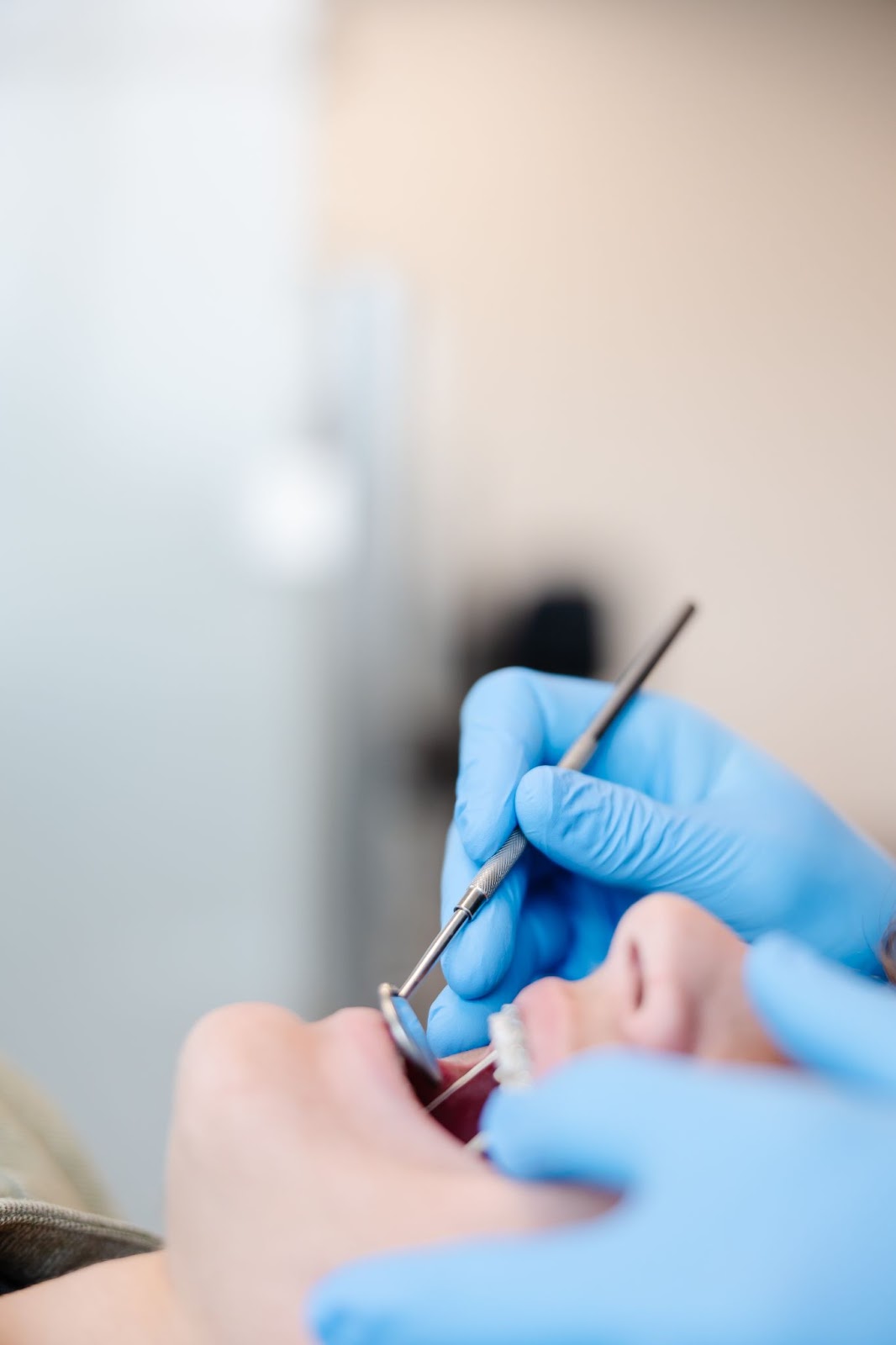 Person getting a dental cleaning.