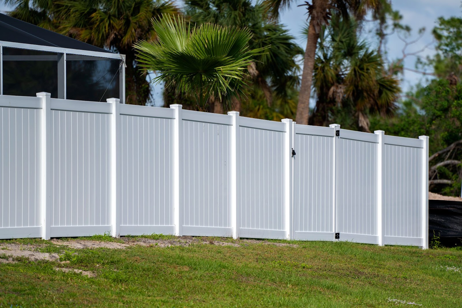 Vinyl fence with a gate. 