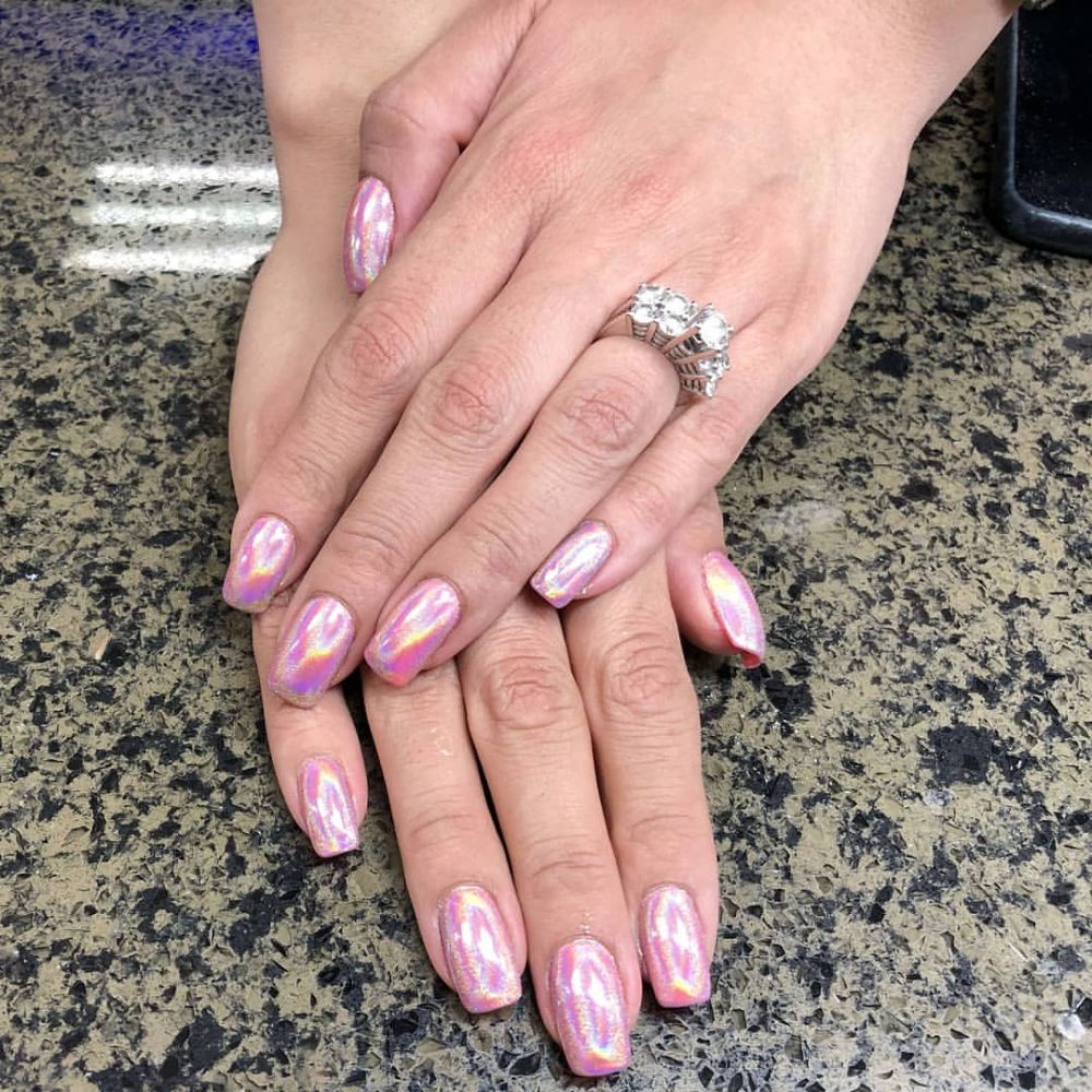 Close up of nails with simple pink nail designs having Pink Hologram design