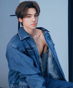 This contain Beomhan is posing in his denim jacket