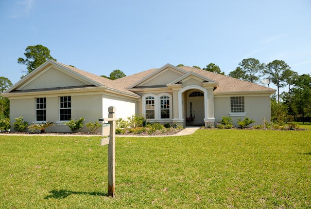 A home with a large lawn.