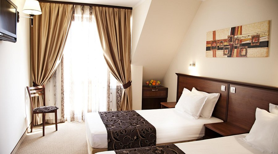 Hotel Favorit exterior with Alexander Nevsky Cathedral in the background
