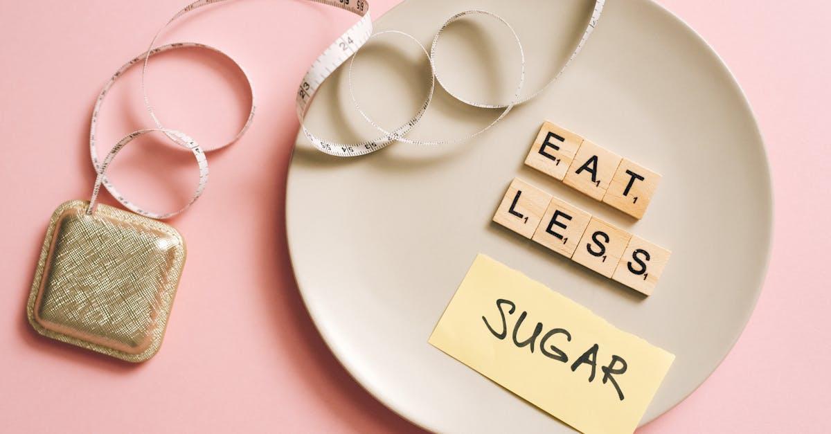 A conceptual image featuring a plate with messages made from Scrabble tiles and a tape measure, promoting healthy eating.