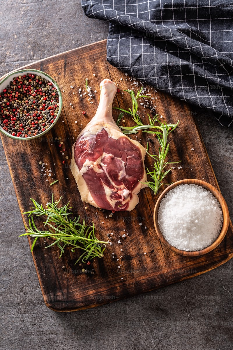 Stock photo of raw meat on a cutting board, dressed up to look fancy.