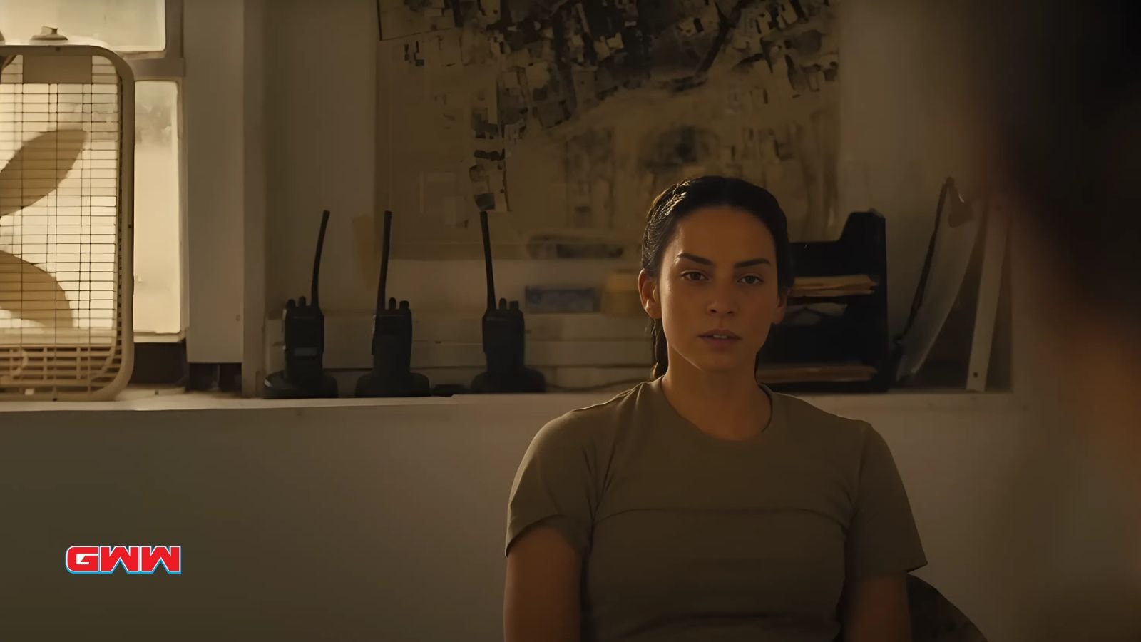 Laysla De Oliveira portraying Cruz, seated in a tense scene in Lioness.