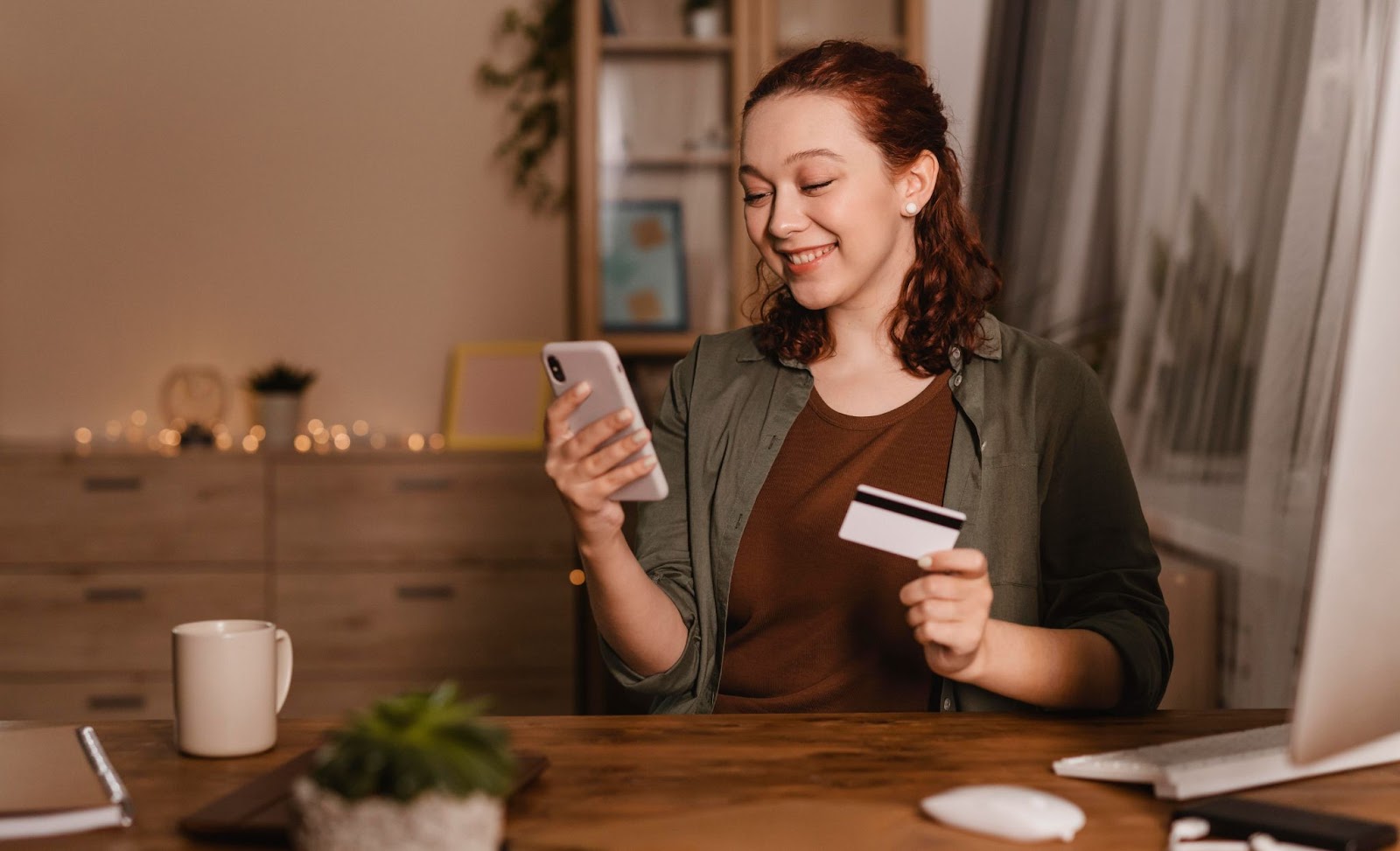 woman using credit card to pay for online transaction