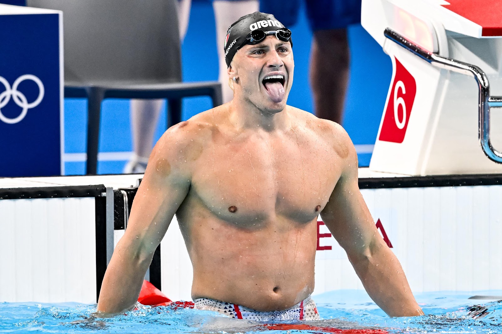 Nicolo Martinenghi of Italy celebrates with his tongue out after winning gold in the Men's 100m Breaststroke Final at the Paris 2024 Olympic Games on July 28, 2024 | Source: Getty Images